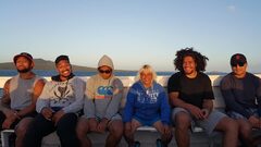Youth group on a charter with Rangitoto Island behind